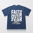 Blue t-shirt with 'Faith Over Fear' text and cross graphic on a white background