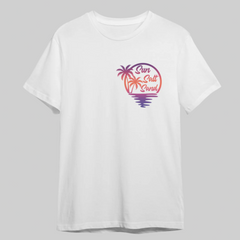 White t-shirt with a colorful palm tree design and 'Sun Salt Sand' text on a gray background